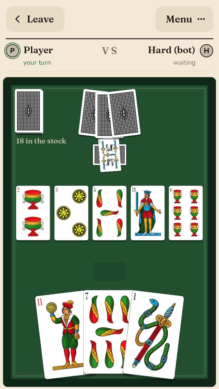 Scopa table with the Neapolitan deck: five cards on the table, the opponent’s pile with a scopa laid crosswise, three cards in hand